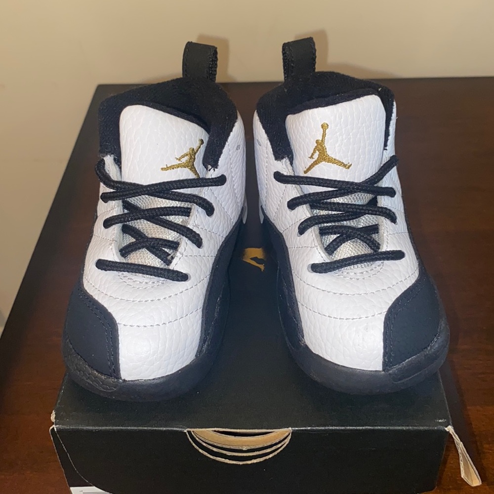 Black and white Jordan 12’s. Toddler sneaker. Size 7c. Brand new.